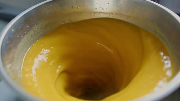 Pureeing and blending juice from fruits harvested naturally from the Amazon rainforest - isolated cl alt