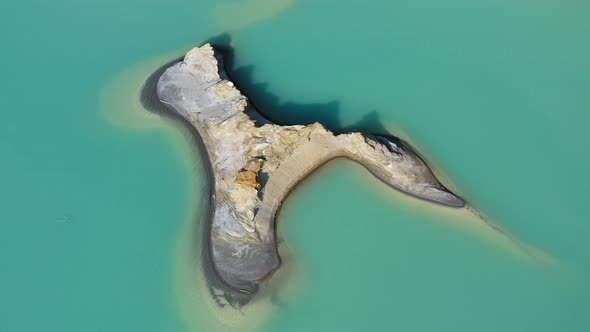 Drone View of the Turquoise Lake Formed As a Result of Mining Waste alt