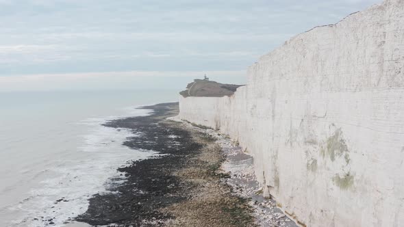 Long drone shot towards belle tout light house along White cliffs UK alt