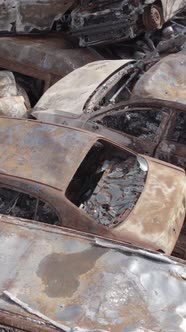 Vertical Video of Wartorn Cars in Ukraine alt