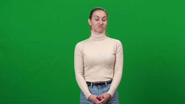 Portrait of Dissatisfied Young Woman Showing Thumb Down Shaking Head No alt