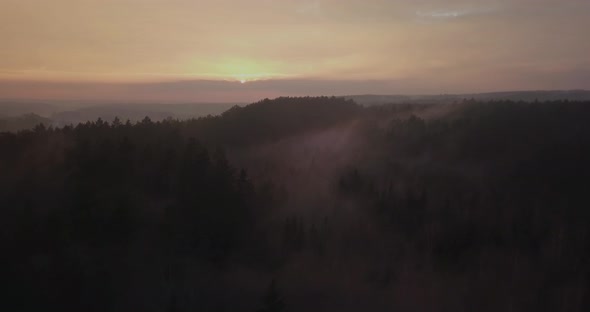 Sunset Above Misty Forests in Lithuania, Europe