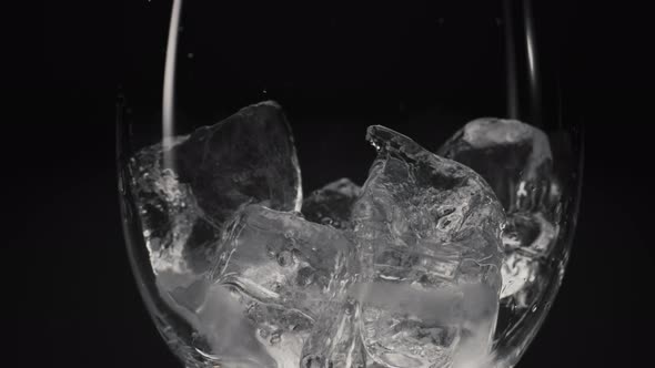Ice Cubes Falling Empty Transparent Glass Closeup alt