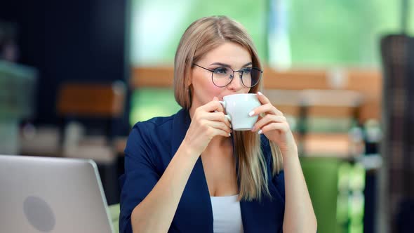 Relaxed Happy Business Female Drinking Coffee Enjoying Break at Modern Office Background alt