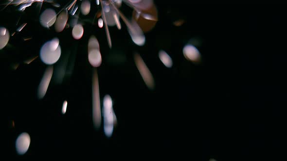 Bengal Light Burns with Sparks, Black Background, Close Up alt