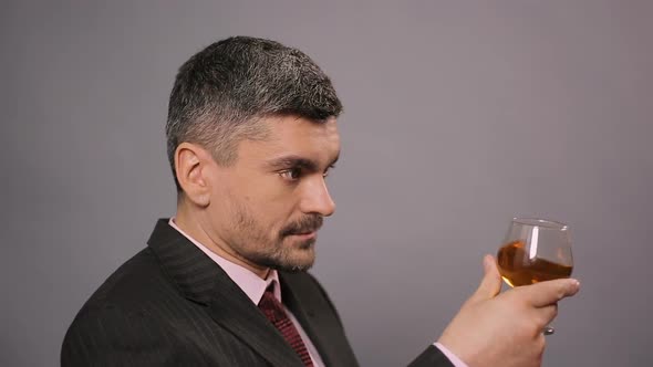 Dissatisfied Connoisseur Tasting Cheap Scotch at Cafe, Displeased Taster alt