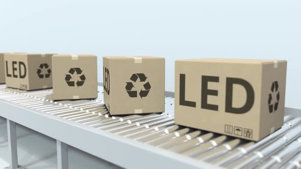 Cartons with LED Lighting Equipment on Conveyor alt