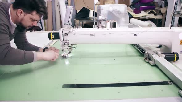 Operator Is Serving Computerized Automatic Quilting Machine alt