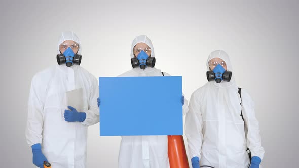 Group of Epidemiologists in Protective Uniform Holding Blank Placard on Gradient Background alt