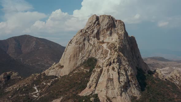 Aerial view of rock formation and little city on the foot. Mexico