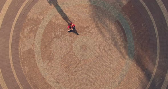 Beautiful Aerial View of Dancers on a Paved Square Passionate Tango