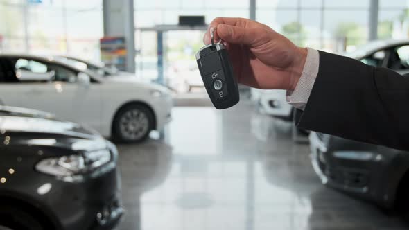 Salesman Dealer Hold a Car Keys. alt