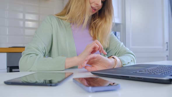 Happy woman using modern smart wrist watches for online communication in 4k video alt