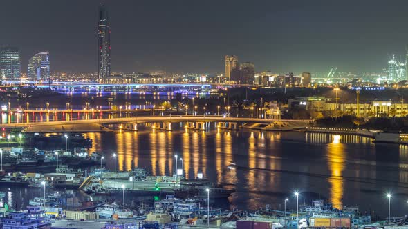 Dubai Creek Landscape Night Timelapse with Boats and Ship Near Waterfront alt
