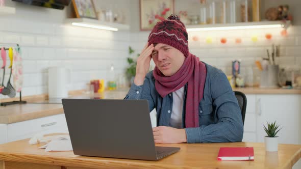 Man checks possible symptoms with professional physician, using online video chat. Man sick at home alt