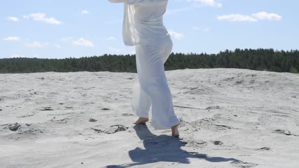 Beautiful Woman Walking on Shore