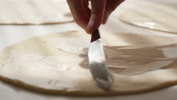 Hand puff pastry  making with fat spreading over dough  proffesional  4K 2160p UltraHD footage - Lam alt