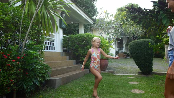 Mom Treats Daughter's Skin with Mosquito Repellent alt