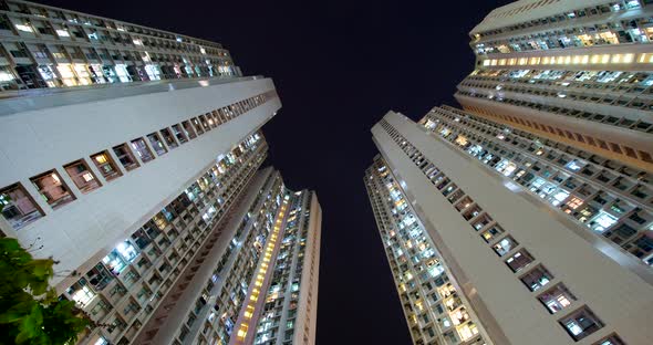 Timelapse of Hong Kong residential skyscraper at night alt