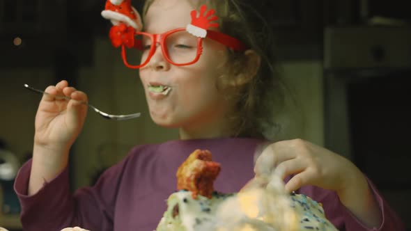 The Girl is Eating Cake with Green Dough Sour Cherries and Sour Cream alt