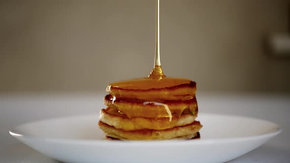 Pouring Honey On Pancakes alt