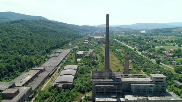 Exterior abandoned factory  complex in Loznica Serbia Chimneys aerial drone shot
