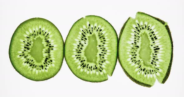Crushing and Squeezing Three Kiwi Fruit Slices alt