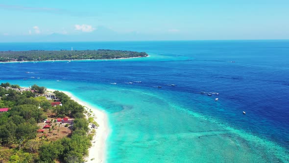Many boats gliding on the calm sea between islands. Aerial seascape, Gili, Indonesia alt