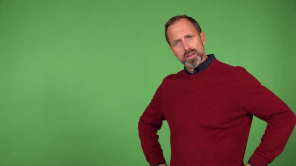 A Middleaged Handsome Caucasian Man Shakes His Head at the Camera  Green Screen Background