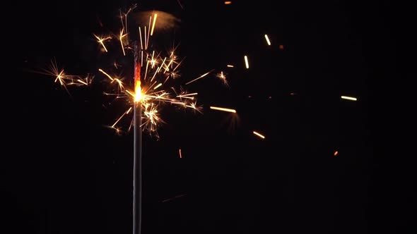 Fireworks Sparkler Close-up on a Black Background. Timelapse