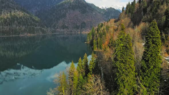 Clear Blue Mountain Lake with Reflection of Clouds on the Water alt