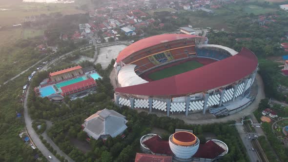 Aerial top down view of the Beautiful scenery of Wibawa Mukti Stadium when sunrise alt