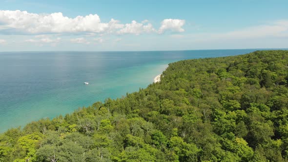 Aerial view of turquoise Lake Huron waters from Mackinaw Island State Park alt