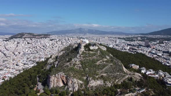 Drone View of Mount Lycabettus Surrounded By the Endless Quarters of Athens alt