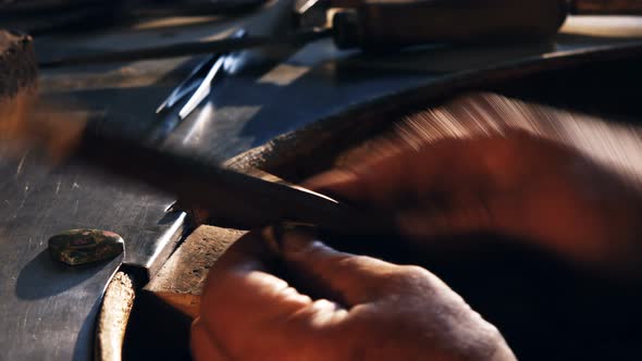 Goldsmith preparing ring alt