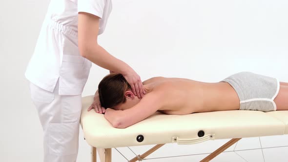 Salon neck massage for relaxation. Action. Professional restorative massage of neck alt