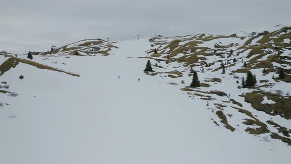 Aerial, Beautiful Winter Landscape In Mountains And Skiers On Ski Tracks In Dolomites In Italy