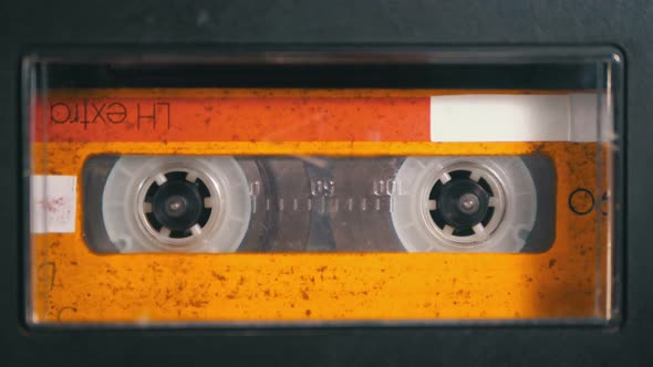 Audio Tape. Vintage Tape Recorder Plays Audio Cassette Inserted Therein alt