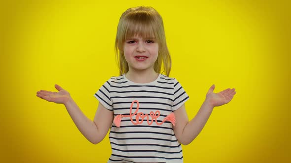Confused Blonde Child Girl Raising Hands in Indignant Expression Asking Why What Reason of Failure alt