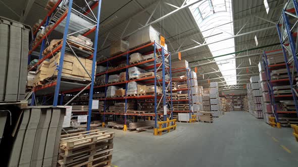 View of the storage with parquet at the factory from the inside. Business. alt