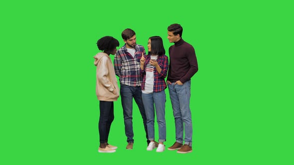 A Young Girl Using Her Smartphones Voice Assistant to Learn Some Information for Her Friends on a alt