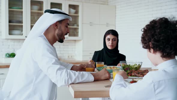 arabian family spending time together at home alt