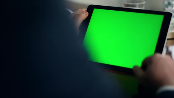 Closeup Green Tablet Screen in Luxury Office alt