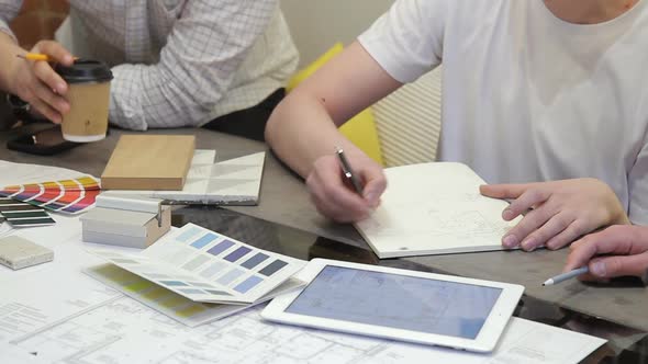 Men Sitting in Office Working on Building Project Laptop alt