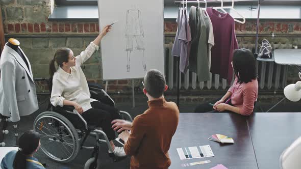 Female Fashion Designer Having Meeting with her Team alt