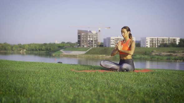 Healthy Woman Meditating Outdoor