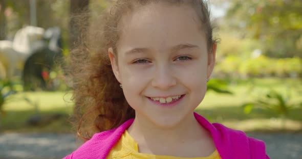 Cute Child with Pretty Face on Street alt