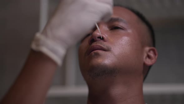 antigen test kit with a COVID-19 2019-nCoV viral disease test kit, people at home performing rapid alt