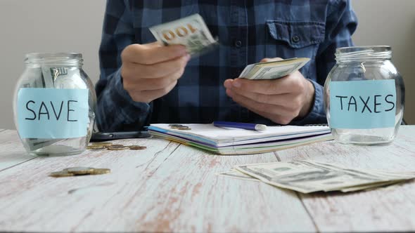 Saving money concept. Calculating money, accounting bills, putting money in jars alt