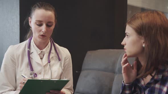 Young Adult Nurse Talking with Patient at Home